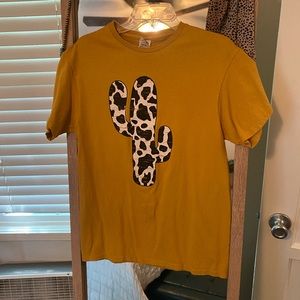 Mustard yellow distressed cow print cactus graphic tee